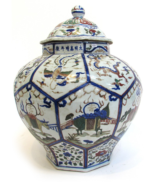 Ming dynasty lidded jar featuring reserves with dragons, phoenixes and chimeras, 20 inches tall. Price realized: $26,400. Gordon S. Converse & Co. image